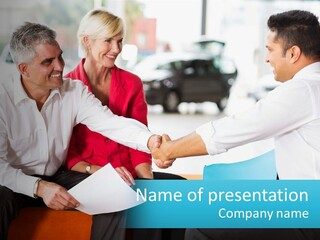 A Couple Of People Shaking Hands Over A Piece Of Paper PowerPoint Template