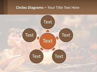 A Table Topped With Cakes And Pastries Covered In Icing PowerPoint Template