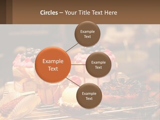 A Table Topped With Cakes And Pastries Covered In Icing PowerPoint Template