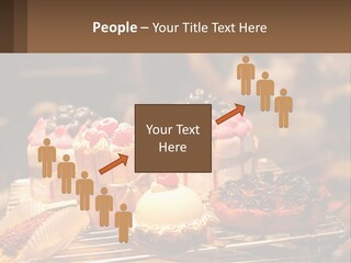 A Table Topped With Cakes And Pastries Covered In Icing PowerPoint Template