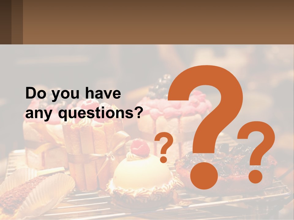 A Table Topped With Cakes And Pastries Covered In Icing PowerPoint Template