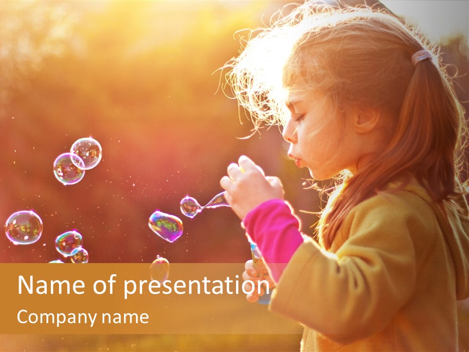 A Little Girl Blowing Bubbles In The Air PowerPoint Template