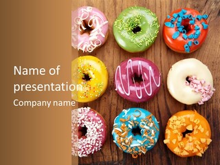 A Group Of Donuts Sitting On Top Of A Wooden Table PowerPoint Template