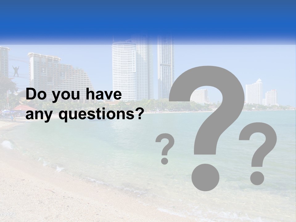 A Beach With A Boat In The Water And A City In The Background PowerPoint Template