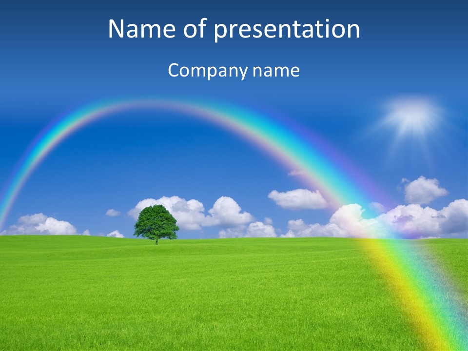 A Green Field With A Rainbow In The Sky PowerPoint Template
