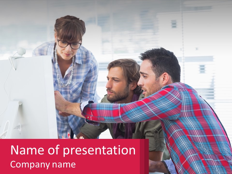 A Group Of People Looking At A Computer Screen PowerPoint Template