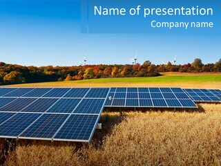 A Group Of Solar Panels In A Field PowerPoint Template