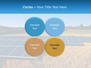 A Group Of Solar Panels In A Field PowerPoint Template