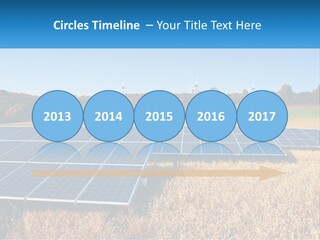 A Group Of Solar Panels In A Field PowerPoint Template
