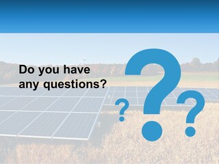 A Group Of Solar Panels In A Field PowerPoint Template