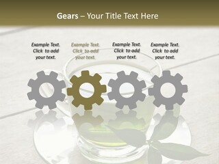 A Cup Of Green Tea With A Leaf On A Saucer PowerPoint Template