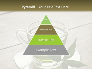 A Cup Of Green Tea With A Leaf On A Saucer PowerPoint Template