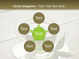 A Cup Of Green Tea With A Leaf On A Saucer PowerPoint Template