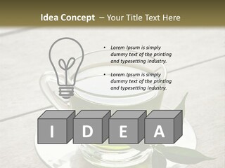 A Cup Of Green Tea With A Leaf On A Saucer PowerPoint Template