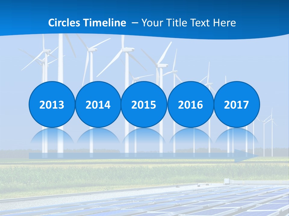 A Solar Power Plant With Windmills In The Background PowerPoint Template