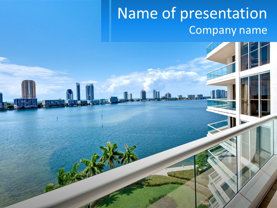 A Balcony Overlooking A Body Of Water With A City In The Background PowerPoint Template