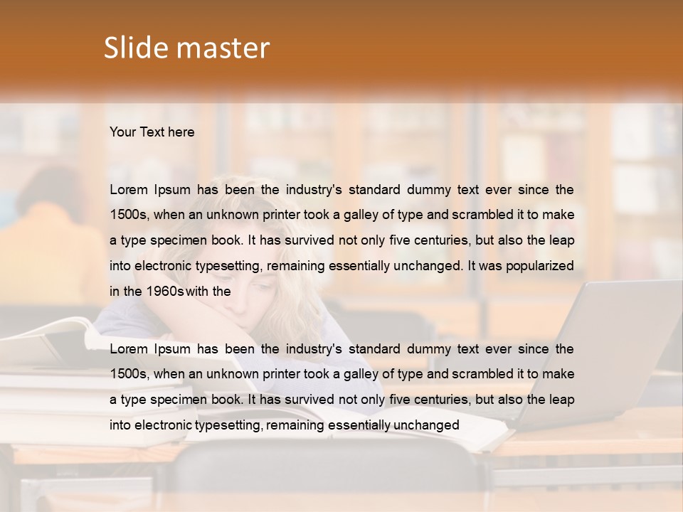 A Woman Sitting At A Desk With A Laptop Computer PowerPoint Template