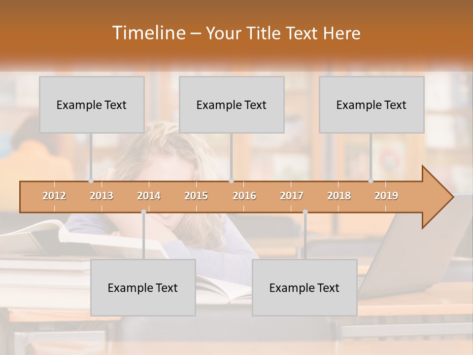 A Woman Sitting At A Desk With A Laptop Computer PowerPoint Template