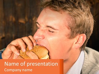 A Man Eating A Hot Dog In Front Of A Wooden Wall PowerPoint Template