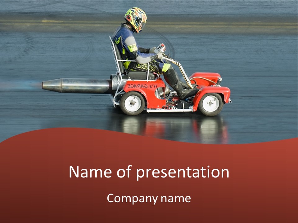A Man Riding A Small Red Firetruck On Top Of A Wet Ground PowerPoint Template