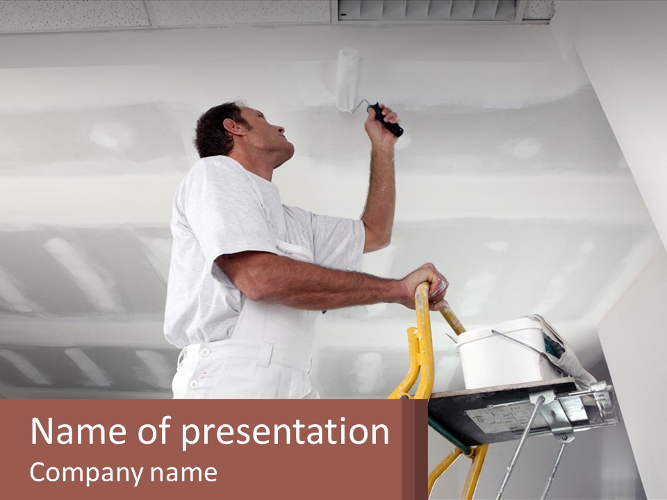 A Man Painting A Ceiling With A Paint Roller PowerPoint Template