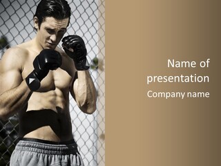 A Man Wearing Boxing Gloves Is Posing For A Picture PowerPoint Template