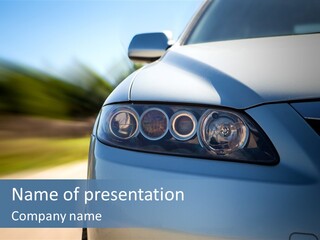 A Blue Car Driving Down A Road With A Blurry Background PowerPoint Template
