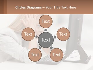 A Woman Sitting In Front Of A Computer With Her Hands On Her Head PowerPoint Template