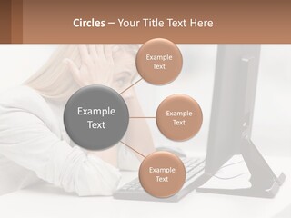 A Woman Sitting In Front Of A Computer With Her Hands On Her Head PowerPoint Template