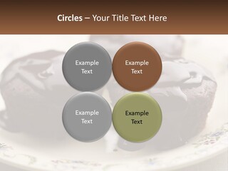 Three Chocolate Muffins On A Plate With Chocolate Drizzled On Them PowerPoint Template