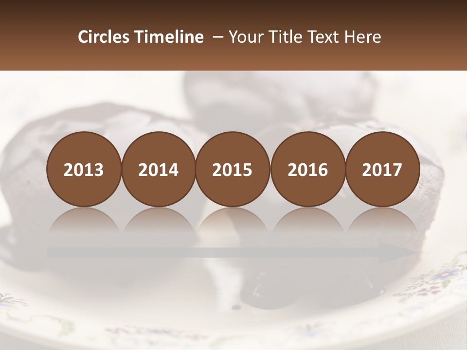 Three Chocolate Muffins On A Plate With Chocolate Drizzled On Them PowerPoint Template