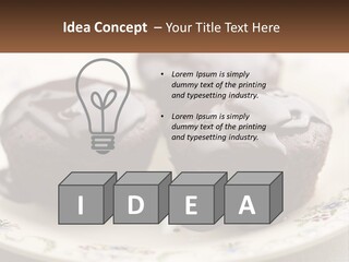 Three Chocolate Muffins On A Plate With Chocolate Drizzled On Them PowerPoint Template