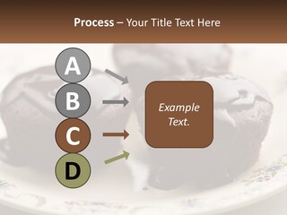 Three Chocolate Muffins On A Plate With Chocolate Drizzled On Them PowerPoint Template