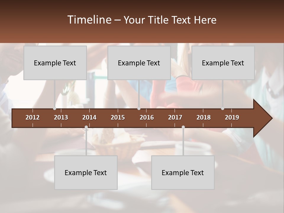 A Group Of People Sitting Around A Wooden Table PowerPoint Template