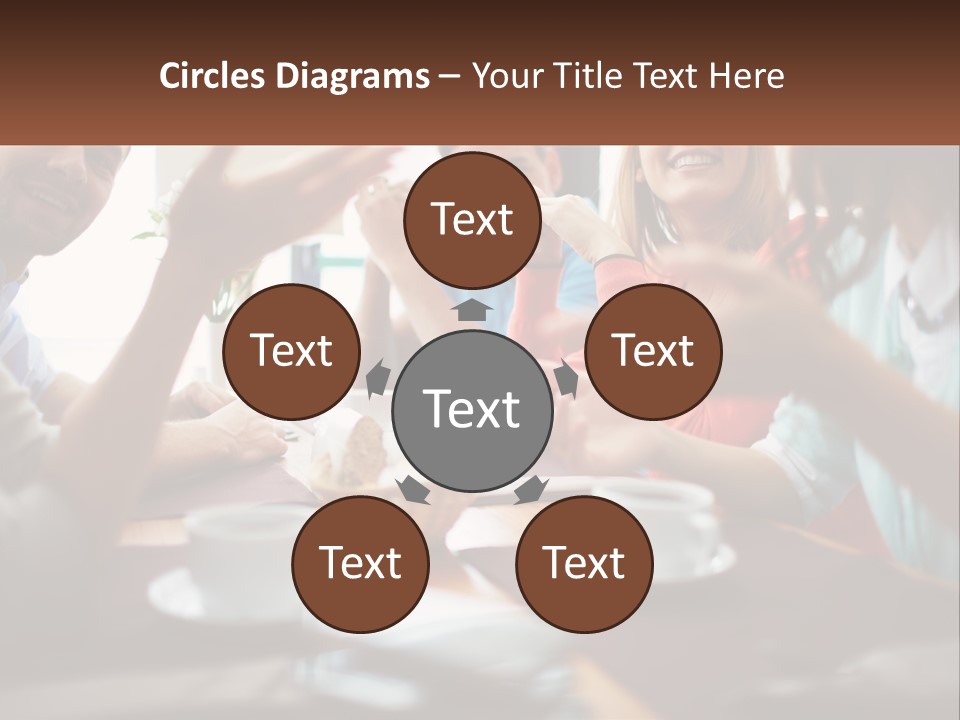 A Group Of People Sitting Around A Wooden Table PowerPoint Template