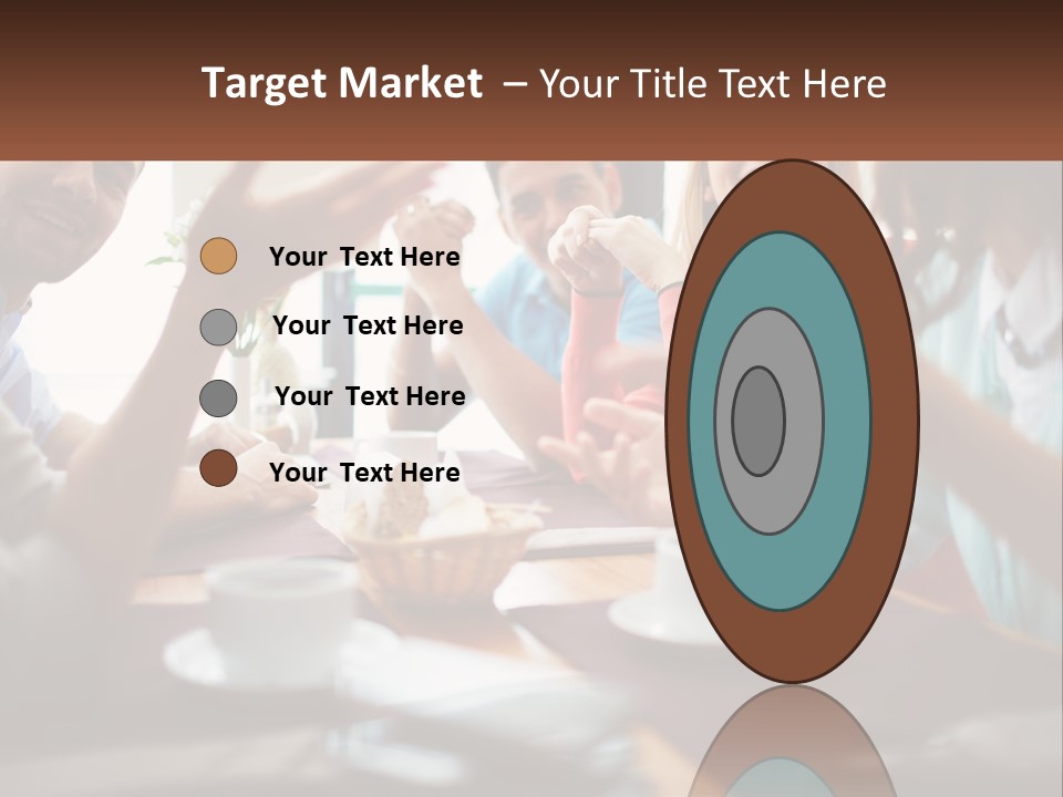 A Group Of People Sitting Around A Wooden Table PowerPoint Template