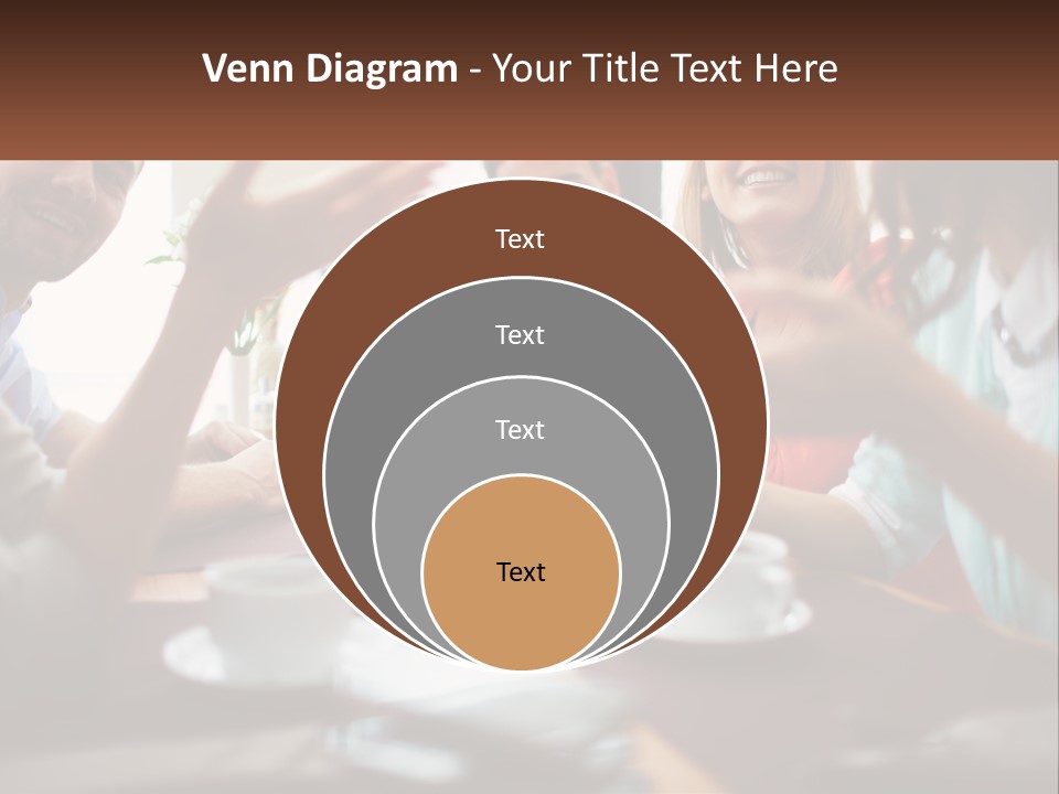 A Group Of People Sitting Around A Wooden Table PowerPoint Template
