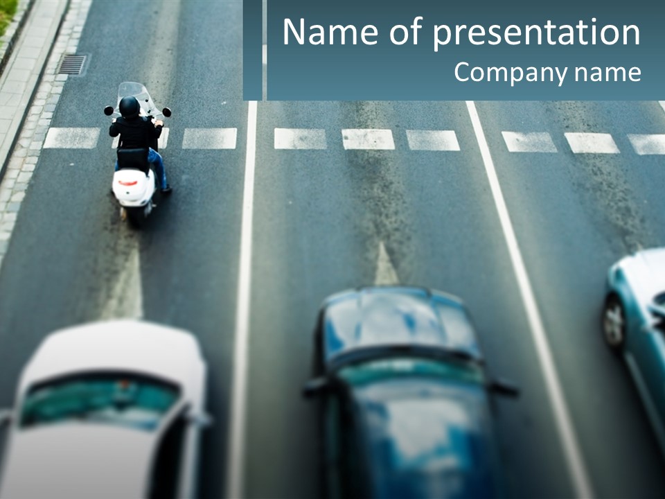 A Motorcyclist Riding Down The Road In Traffic PowerPoint Template