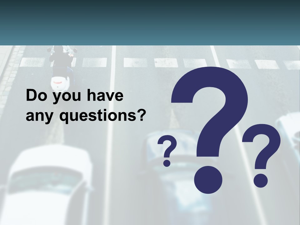 A Motorcyclist Riding Down The Road In Traffic PowerPoint Template