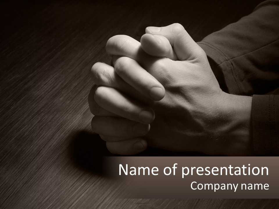 Two Hands Holding Each Other Over A Table PowerPoint Template