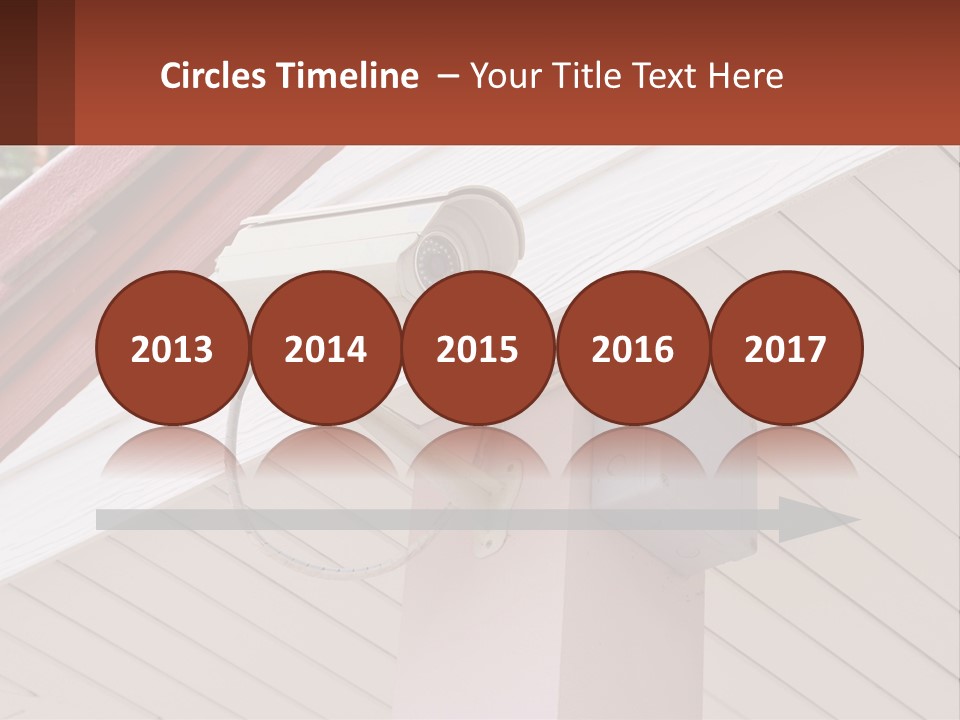 A Security Camera Attached To The Side Of A House PowerPoint Template