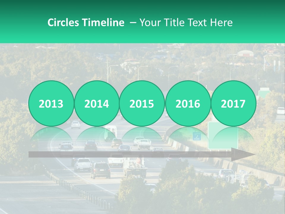 A Highway Filled With Lots Of Traffic Next To Trees PowerPoint Template