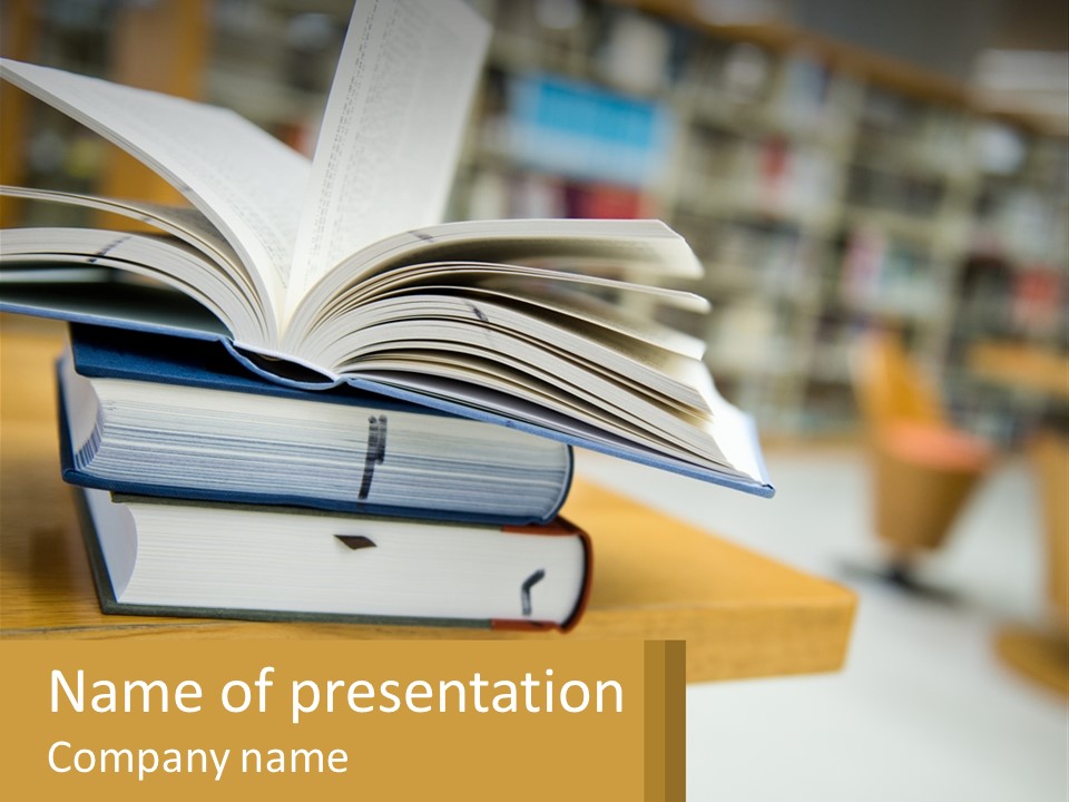 A Stack Of Books On A Table In A Library PowerPoint Template