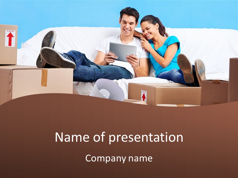 A Man And Woman Sitting On A Couch Surrounded By Boxes PowerPoint Template