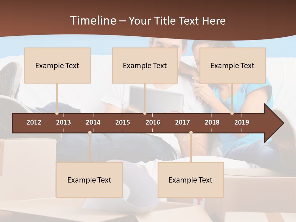 A Man And Woman Sitting On A Couch Surrounded By Boxes PowerPoint Template