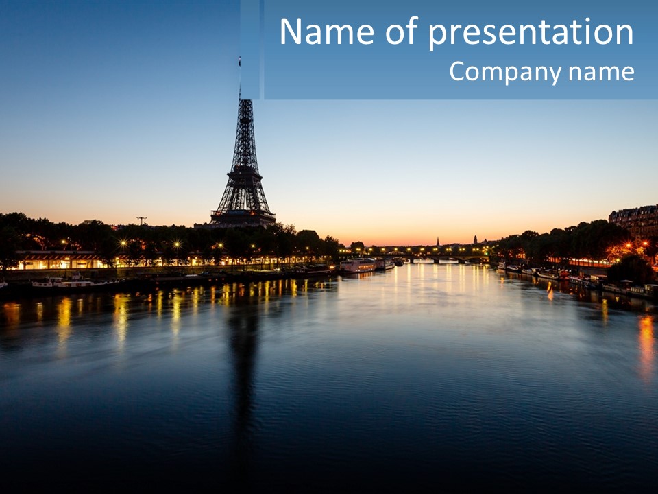 The Eiffel Tower Is Lit Up At Night PowerPoint Template
