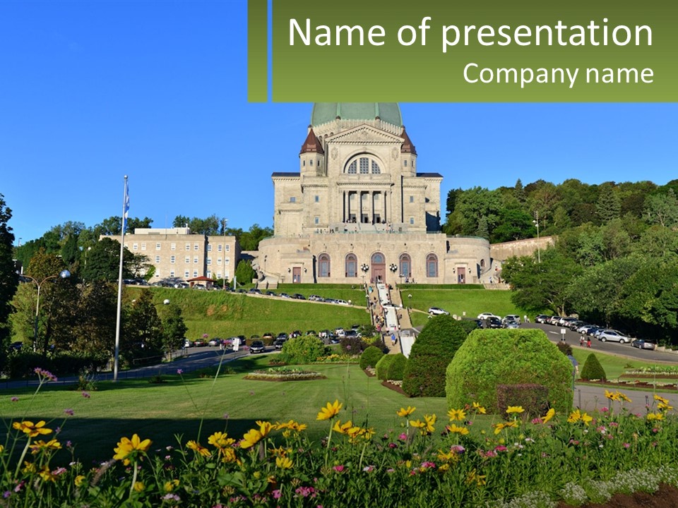 A Large Building With A Lot Of Flowers In Front Of It PowerPoint Template