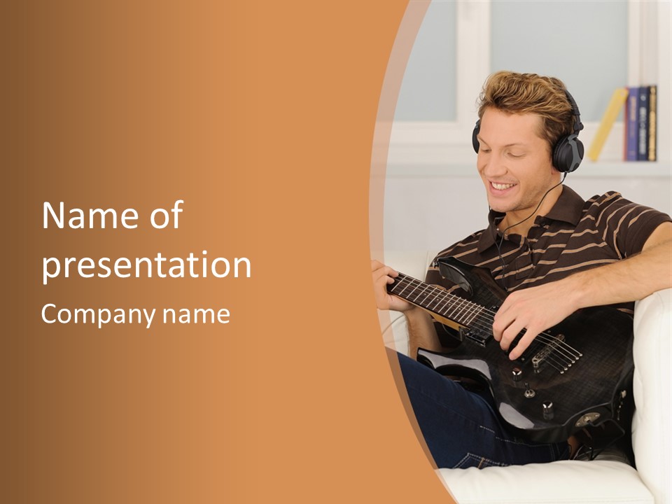 A Man Sitting On A Couch Playing A Guitar PowerPoint Template