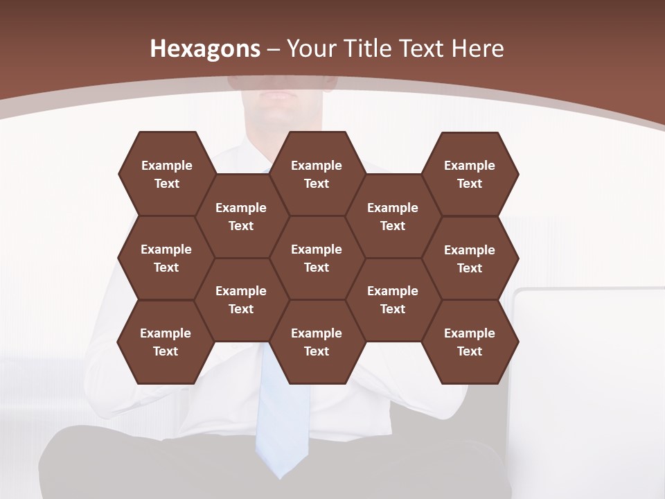 A Man Sitting On A Desk With His Hands Folded In Front Of Him PowerPoint Template
