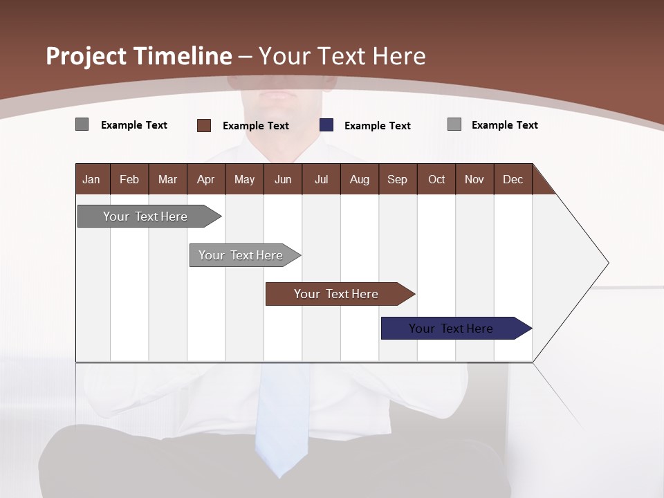 A Man Sitting On A Desk With His Hands Folded In Front Of Him PowerPoint Template